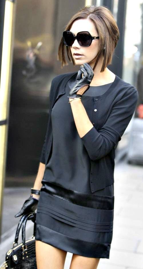 all black mini skirt and top, over sized sunglasses and signature bob